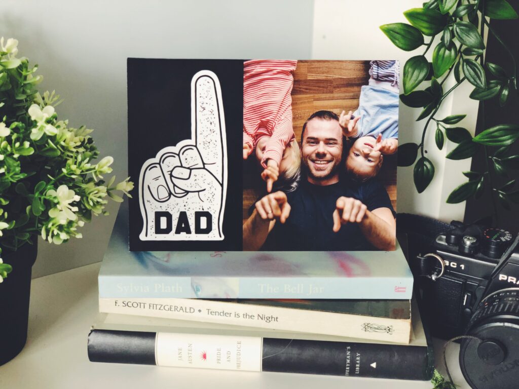 "#1 Dad" Father's Day card on pile of books