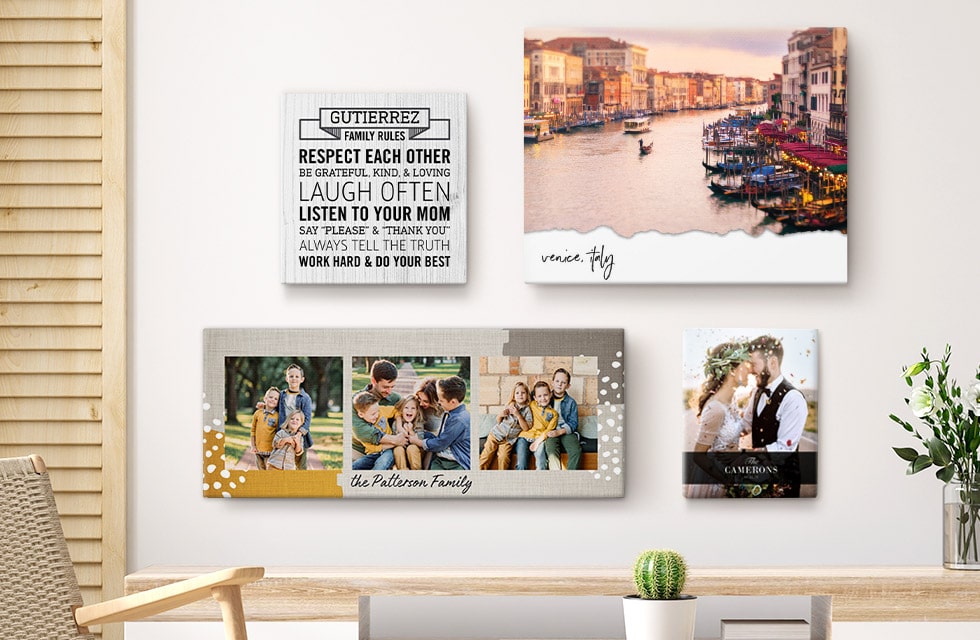 a selection of beautiful canvases displayed on a living room wall