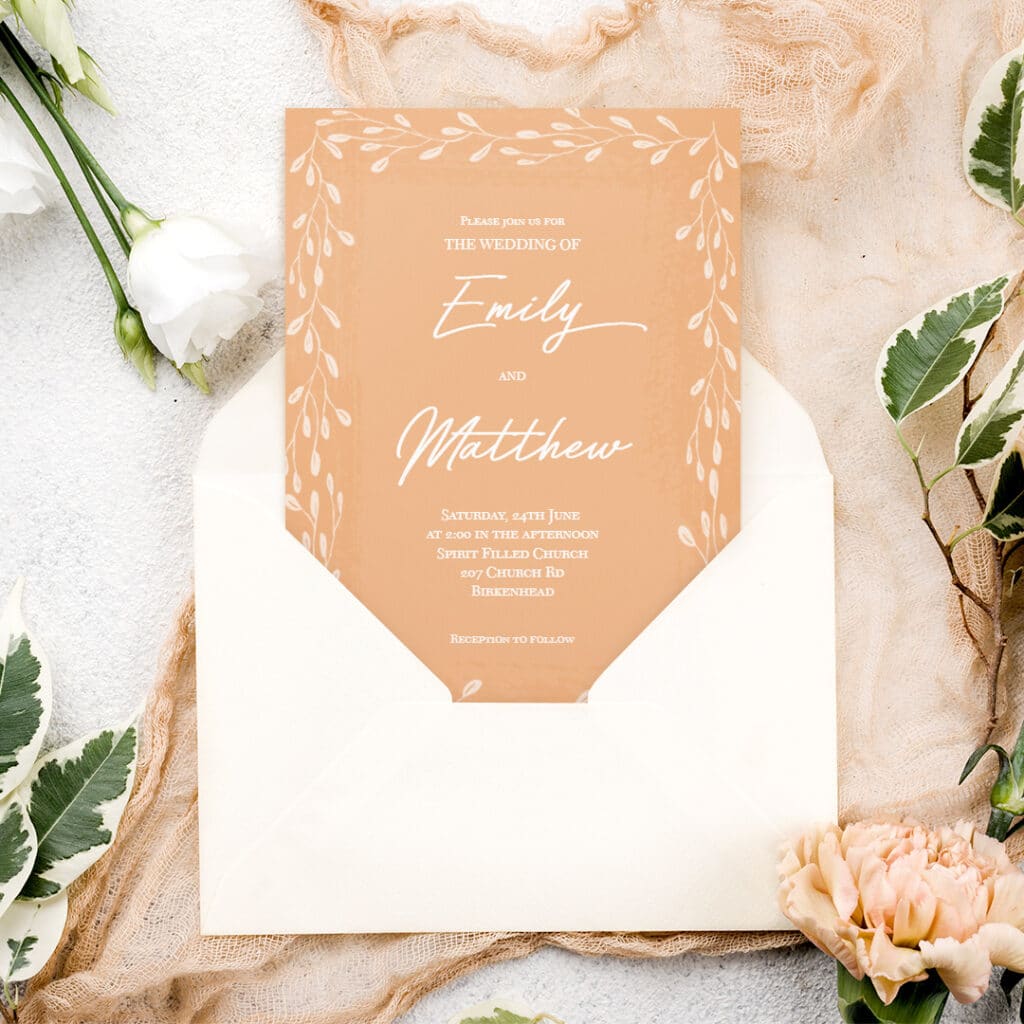 A wedding invitation displayed on a table